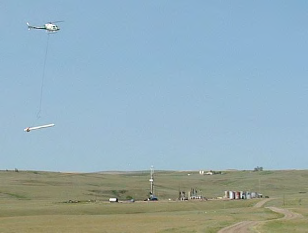 Photograph shows how the airborne electormagnetic surveying is  carried out.