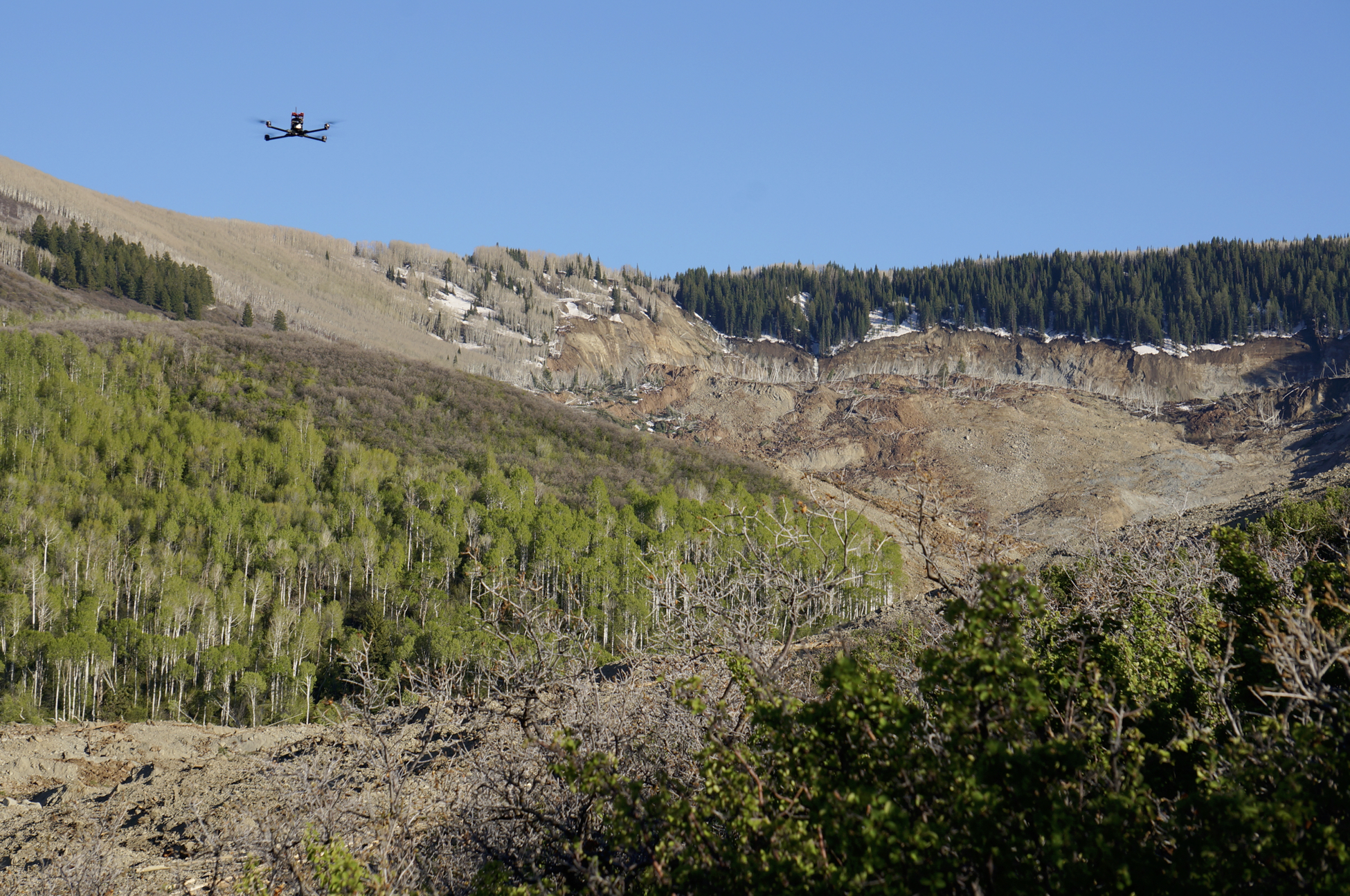 UAS flying over the West Salt Creek landslide on May 26, 2014, one day after the landslide occurred. The view is to the south, looking toward the landslide headscarp. Credit: Sheriff’s Office, Mesa County, Colorado. 