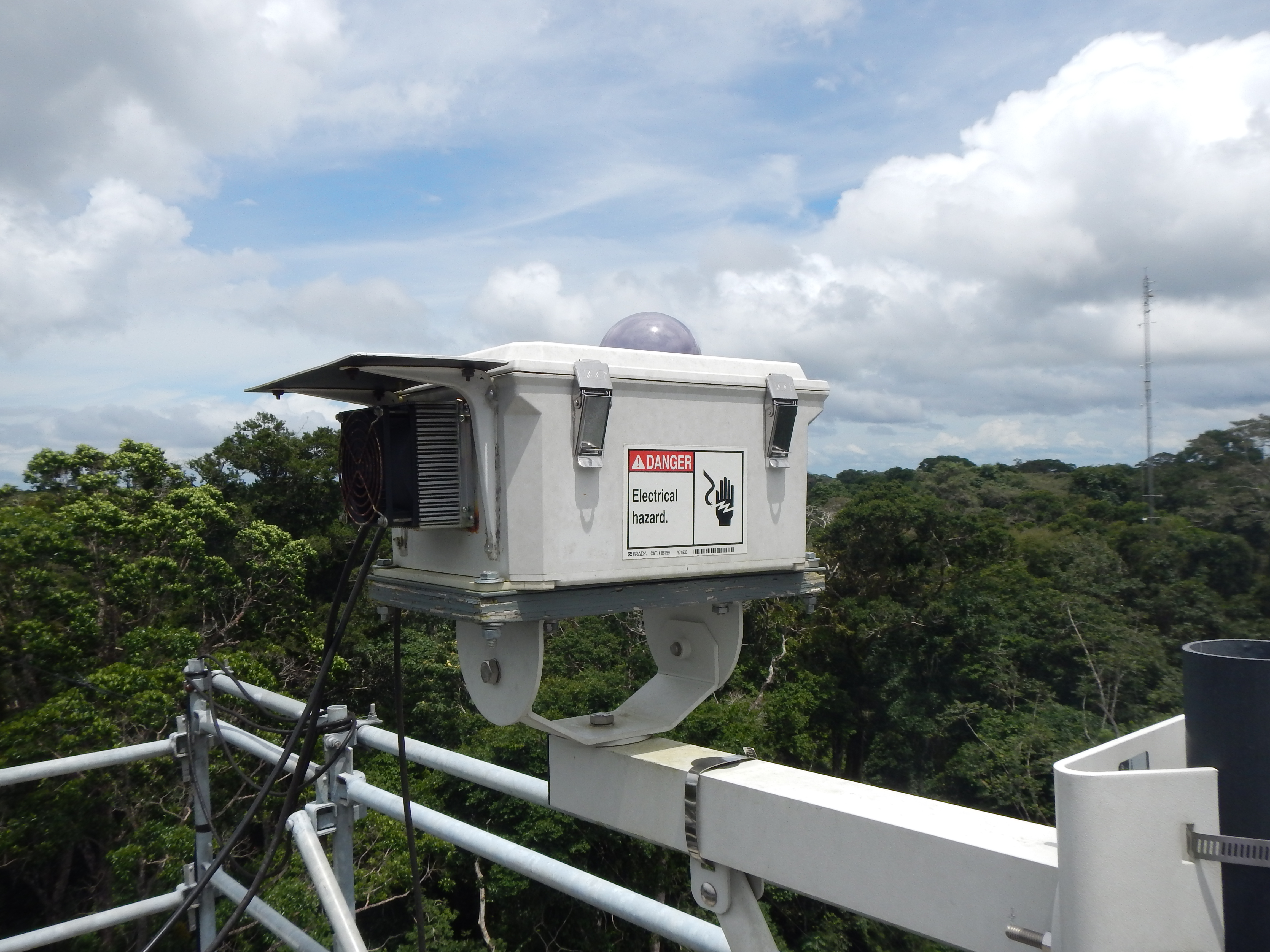 The USGS High Dynamic Range All-Sky Imaging System (HDR-ASIS) measures the sky distribution of solar radiation at a study site near Santarem, Brazil.  Data from this and other tower-based remote sensing instruments are helping USGS scientists and their collaborators develop improved capabilities to account for the role of tropical forests in the global climate system