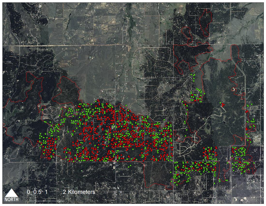 Aerial view of Colorado's Black Forest wildfire of 2013 showing the burn perimeter (red boundary) and the locations of destroyed (red) and unaffected structures (green).