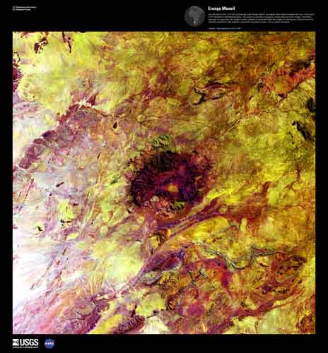 In the center of mottled reds and yellows is a dark red shape that is almost a circle.